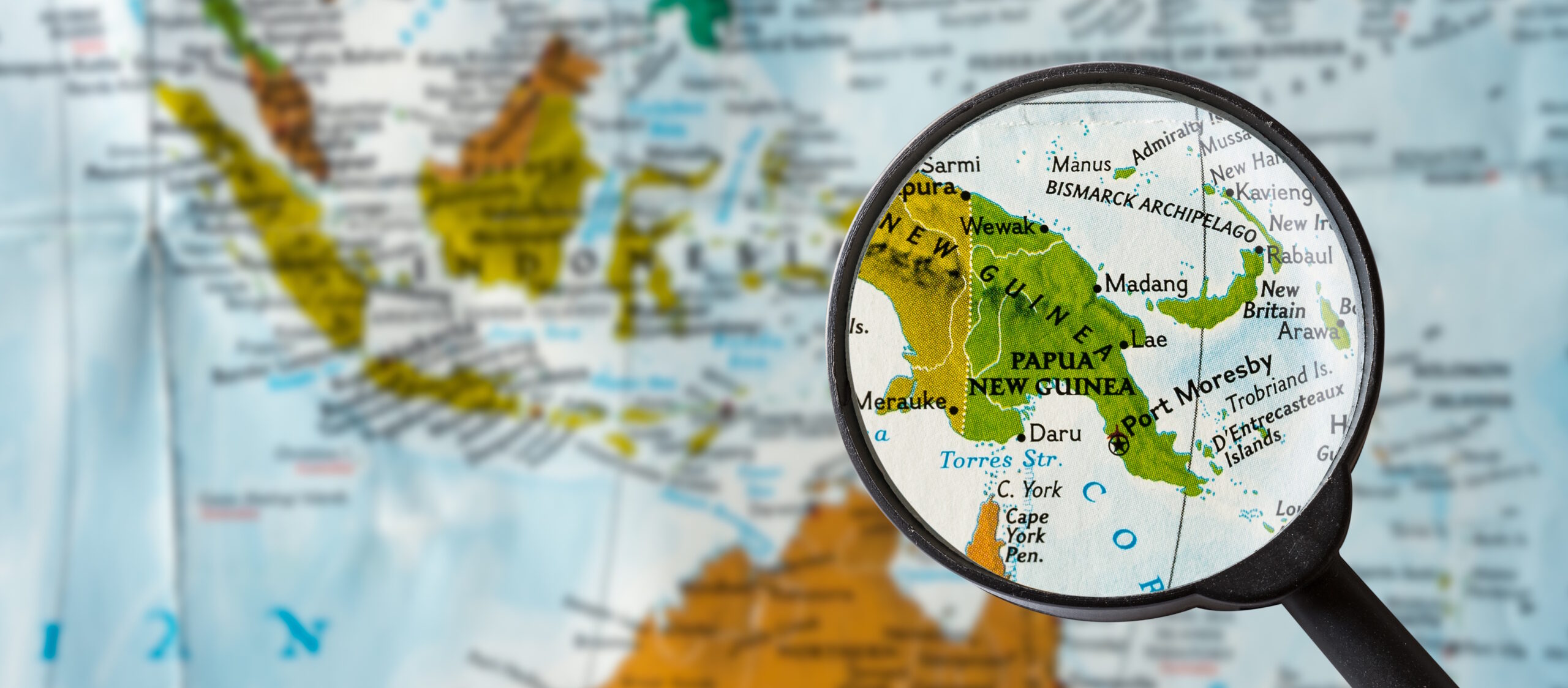 Map of Papua New Guinea seen through a magnifying glass